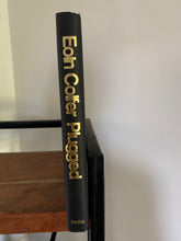 Plugged (signed)