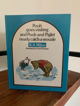 Pooh goes fishing and Pooh and Piglet nearly catch a woozle